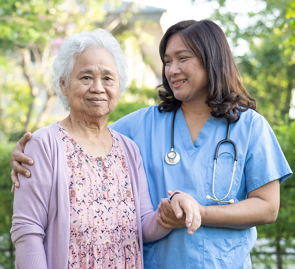 Home health aide providing personal care at home.